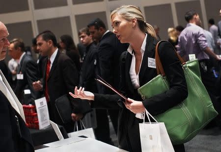 Paige Leonard speaks with a recruiter from a jewelry and gem company during the Gemological Institute Of America (GIA)'s Jewelry Career Fair in New York July 30, 2012. REUTERS/Shannon Stapleton