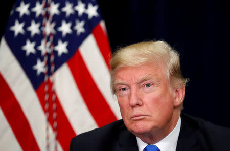 FILE PHOTO: U.S. President Donald Trump listens during a briefing on hurricane Harvey recovery efforts in Dallas, Texas, U.S, October 25, 2017. REUTERS/Kevin Lamarque/File Photo