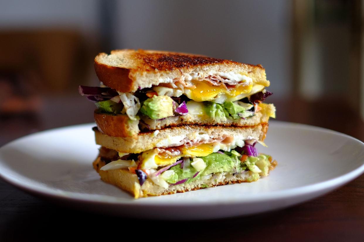 Grilled cheese with egg, avocado, and bacon