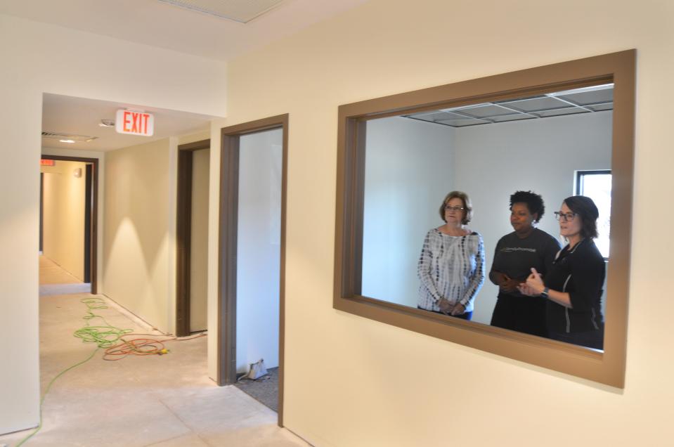 Sandra Henry, vice president of the Henry Family Foundation, is given a tour of Family Promise's new office by Akili Phillips, development coordinator and Tara Pagliarini, executive director. Cocoa Fire Station One on 1st Street is being renovated to house Family Promise, which the Henry Family Foundation has long supported.