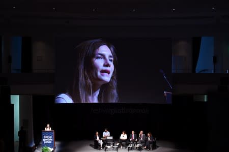 Amanda Knox, who has returned to Italy for the first time since being cleared of the murder of British student Meredith Kercher, speaks at the Criminal Justice Festival in Modena