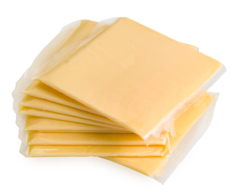 Slices of American cheese wrapped in plastic