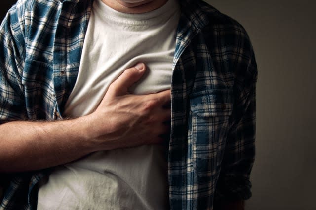 Young adult man suffering from severe heartache.