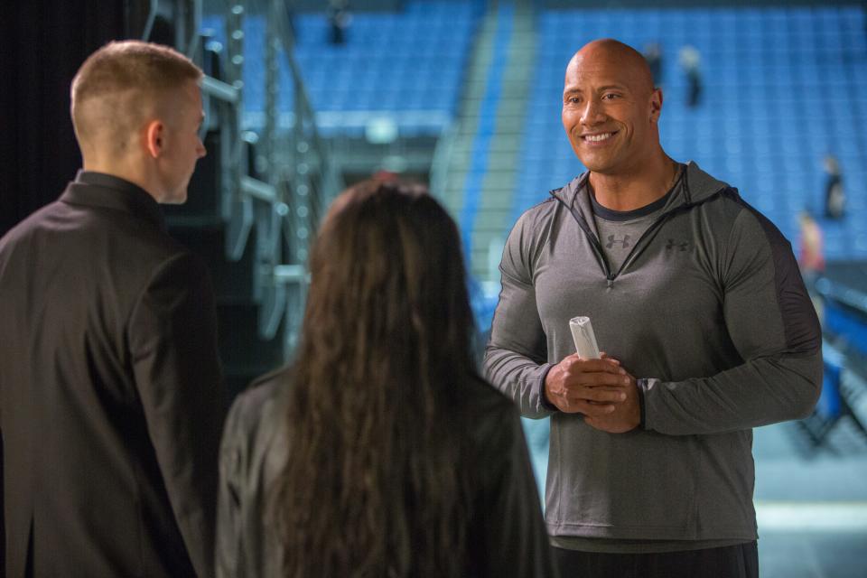 Dwayne Johnson (right) stars as himself in the pro-wrestling biopic "Fighting With My Family."