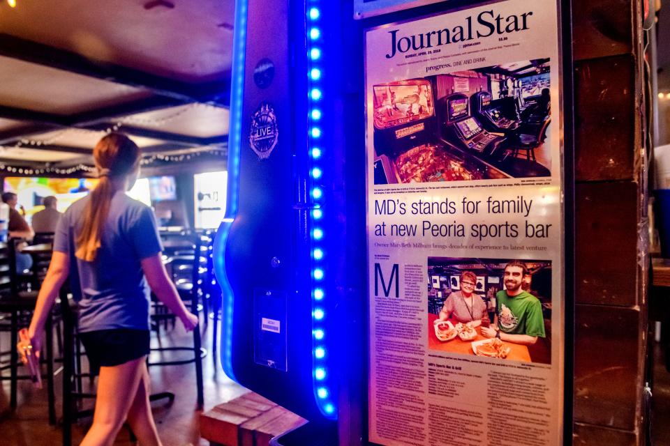 A plaque featuring a Journal Star story on MD's Sports Bar and Grill hangs on a wall at the popular tavern on N. University in Peoria.