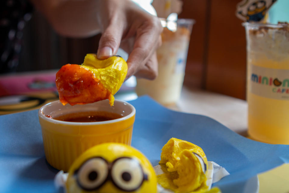 Mantou bun dipped in chilli crab meat dip