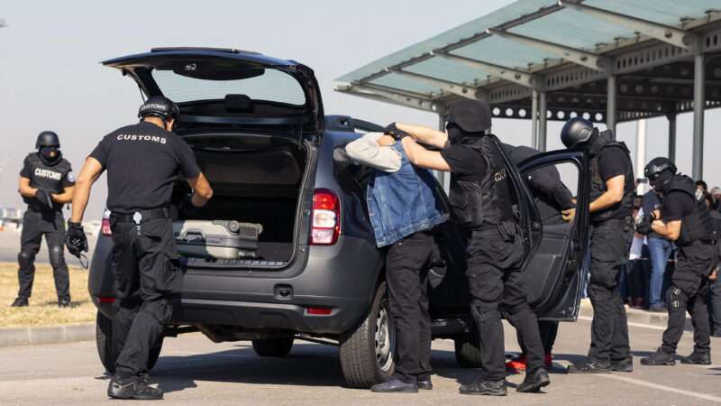 Customs and border protection officers and Drug enforcement administration special forces participate in a training. Unrecognizable people in black