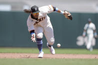 San Francisco Giants shortstop Brandon Crawford (35) barehands a ground ball hit by Philadelphia Phillies' Luke Williams during the third inning of a baseball game Sunday, June 20, 2021, in San Francisco. Williams was out at first base. (AP Photo/Tony Avelar)