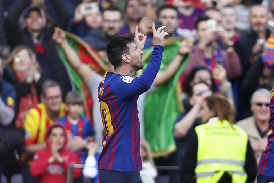 Barcelona's Lionel Messi celebrates after scoring the opening goal during a Spanish La Liga soccer match between FC Barcelona and Espanyol at the Camp Nou stadium in Barcelona, Spain, Saturday March 30, 2019. (AP Photo/Manu Fernandez)
