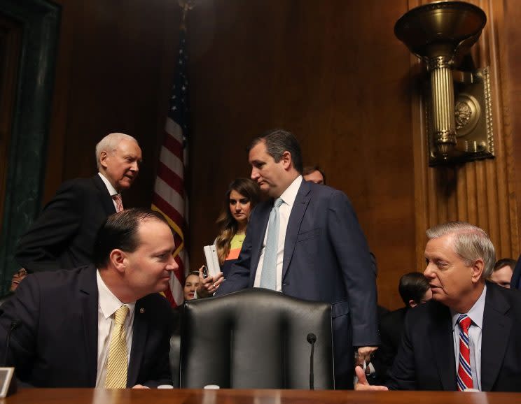 Sen. Mike Lee (R-UT) (L), talks with Sen. Lindsey Graham (R-SC), as Sen. Orrin Hatch (R-UT) and Sen. Ted Cruz (R-TX) stand nearby on Capitol Hill in Washington, D.C. Graham is the only senator pictured to not sign the climate letter to President Trump. (Photo: Mark Wilson/Getty Images)