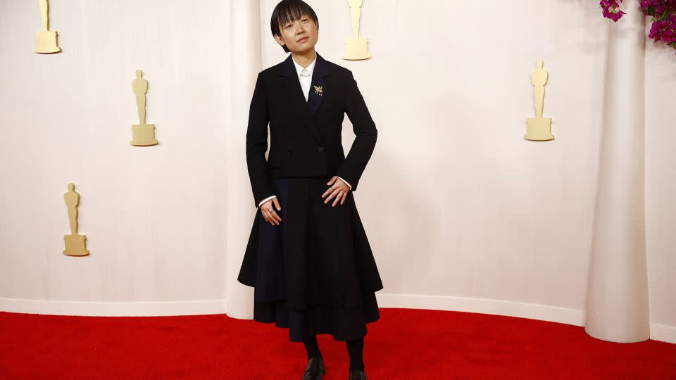 “Past Lives” director Celine Song wore a classy Loewe that paired an elegant blazer with a pleated skirt. - Sarah Meyssonnier/Reuters