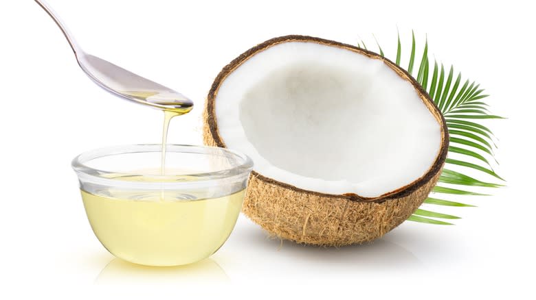 Coconut oil and halved coconut