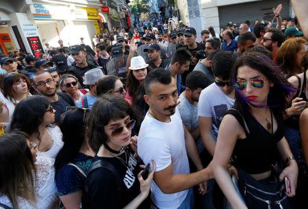 Riot police disperse LGBT rights activists as they try to gather for a pride parade, which was banned by the governorship, in central Istanbul, Turkey, June 25, 2017. REUTERS/Murad Sezer