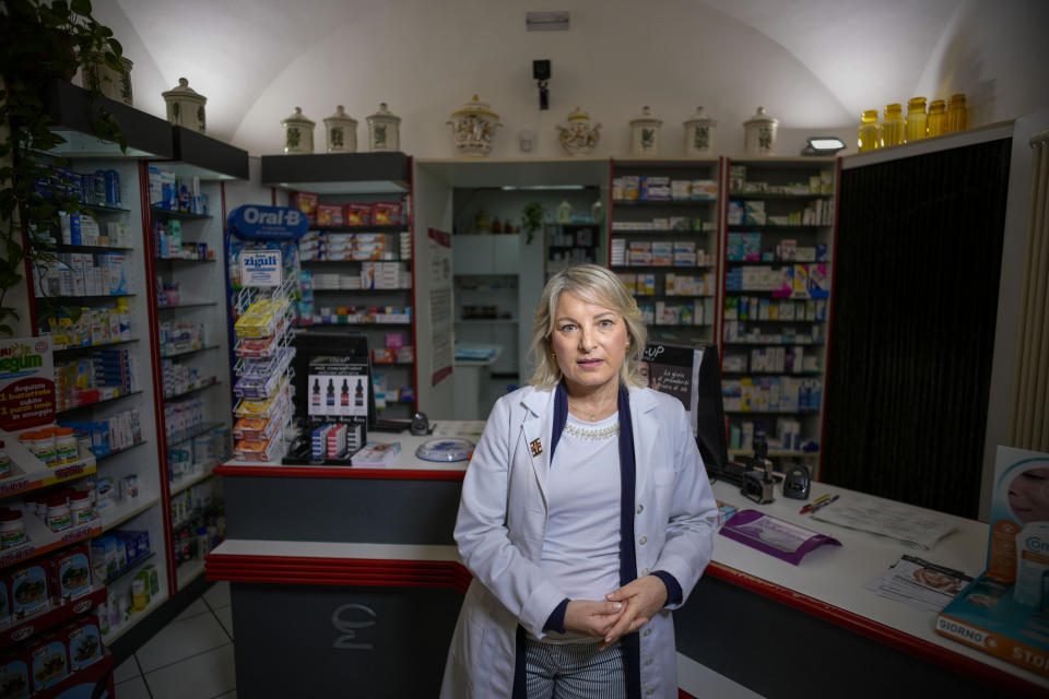 Marta Orsini, third-generation pharmacist, poses in her shop in Isola del Gran Sasso, near Teramo in Central Italy, Sunday, June 4, 2023. (AP Photo/Domenico Stinellis)https://epix.ap.org/#