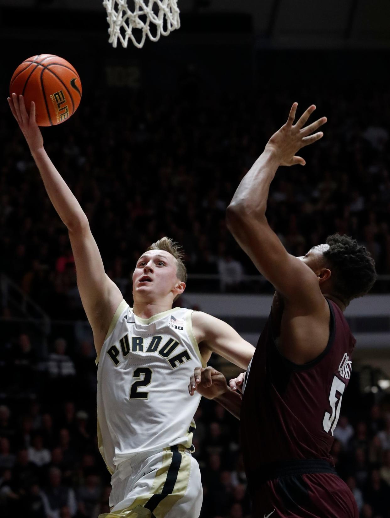 Purdue Boilermakers guard Fletcher Loyer (2) shoots the ball over Eastern Kentucky Colonels forward Isaiah Cozart (50) during the NCAA men’s basketball game, Friday, Dec. 29, 2023, at Mackey Arena in West Lafayette, Ind. Purdue Boilermakers won 80-53.