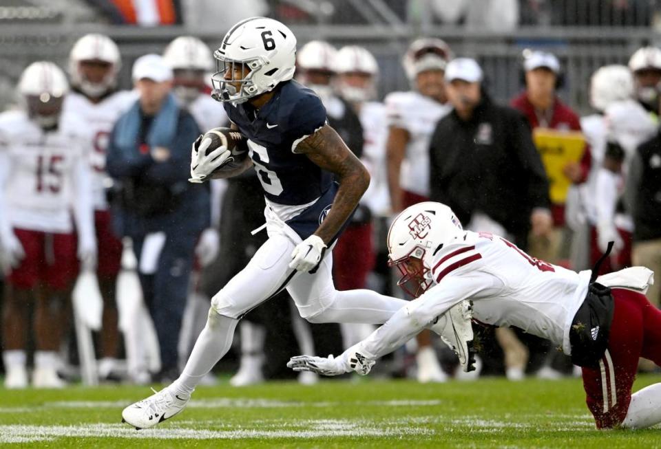 Penn State wide receiver Harrison Wallace III runs down the field with the ball from a UMass defender during the game on Saturday, Oct. 14, 2023.