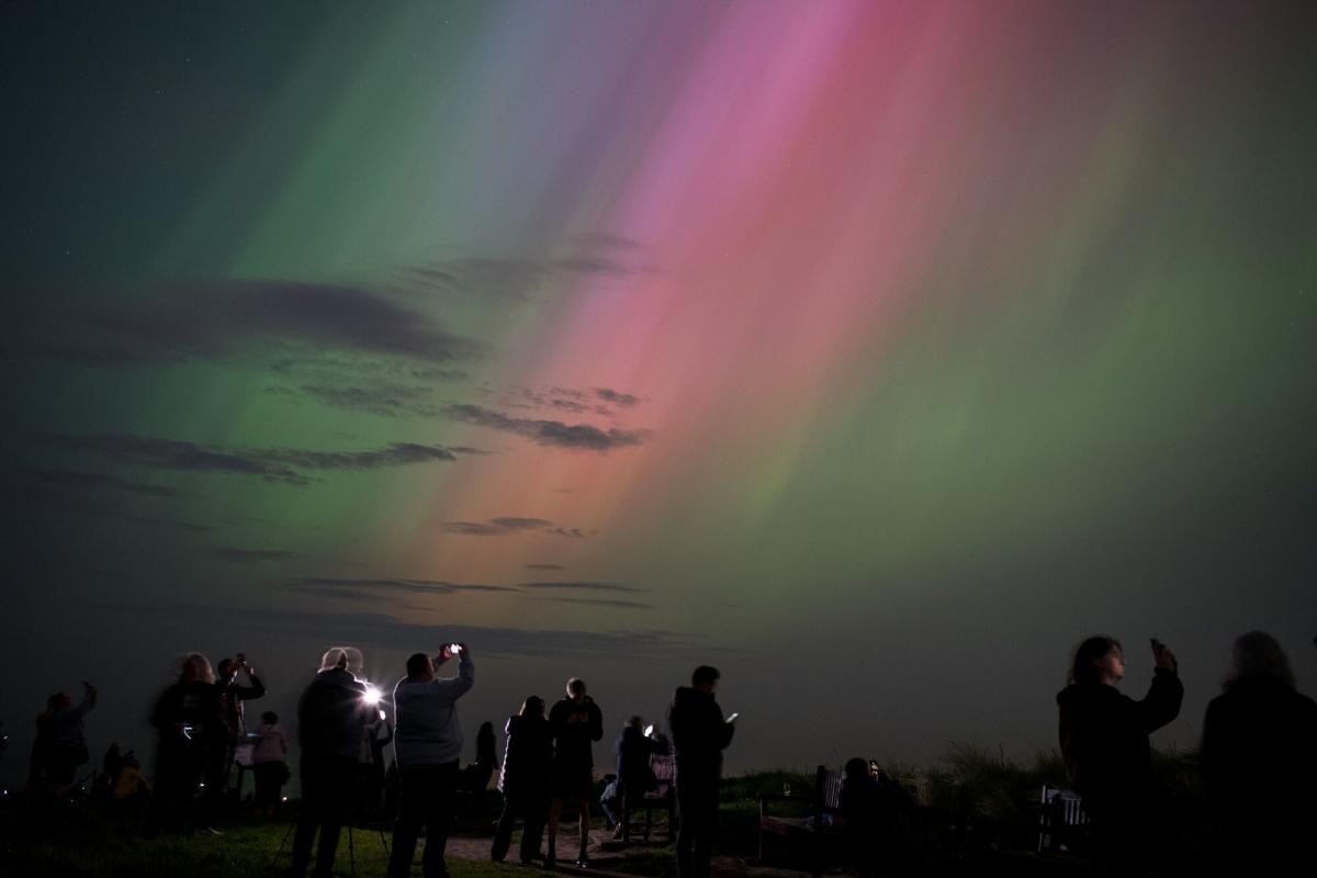 Solar storm causes dazzling auroras and threatens power grids