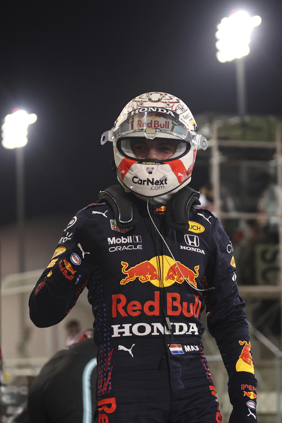 Red Bull driver Max Verstappen of the Netherlands celebrates the qualifying for the Bahrain Formula One Grand Prix, at the Formula One Bahrain International Circuit in Sakhir, Bahrain, Saturday, March 27, 2021. The Bahrain Formula One Grand Prix will take place on Sunday. (Lars Baron, Pool via AP)