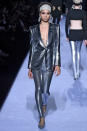 <p>Model wears a silver sequined metallic pantsuit at the fall 2018 Tom Ford show. (Photo: Getty Images) </p>