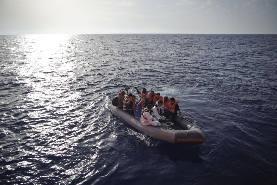 Members of the Maltese Armed Forces take a group of migrants to a Maltese military ship in the Mediterranean Sea, Friday, Sept. 20, 2019. Malta has agreed to take in 35 migrants fleeing Libya who were rescued by the Ocean Viking humanitarian ship a day earlier.(AP Photo/Renata Brito)