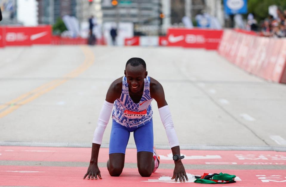 Kelvin Kiptum celebrates winning the Chicago Marathon in a world record time of two hours and 35 seconds on October 8, 2023 (AFP via Getty Images)