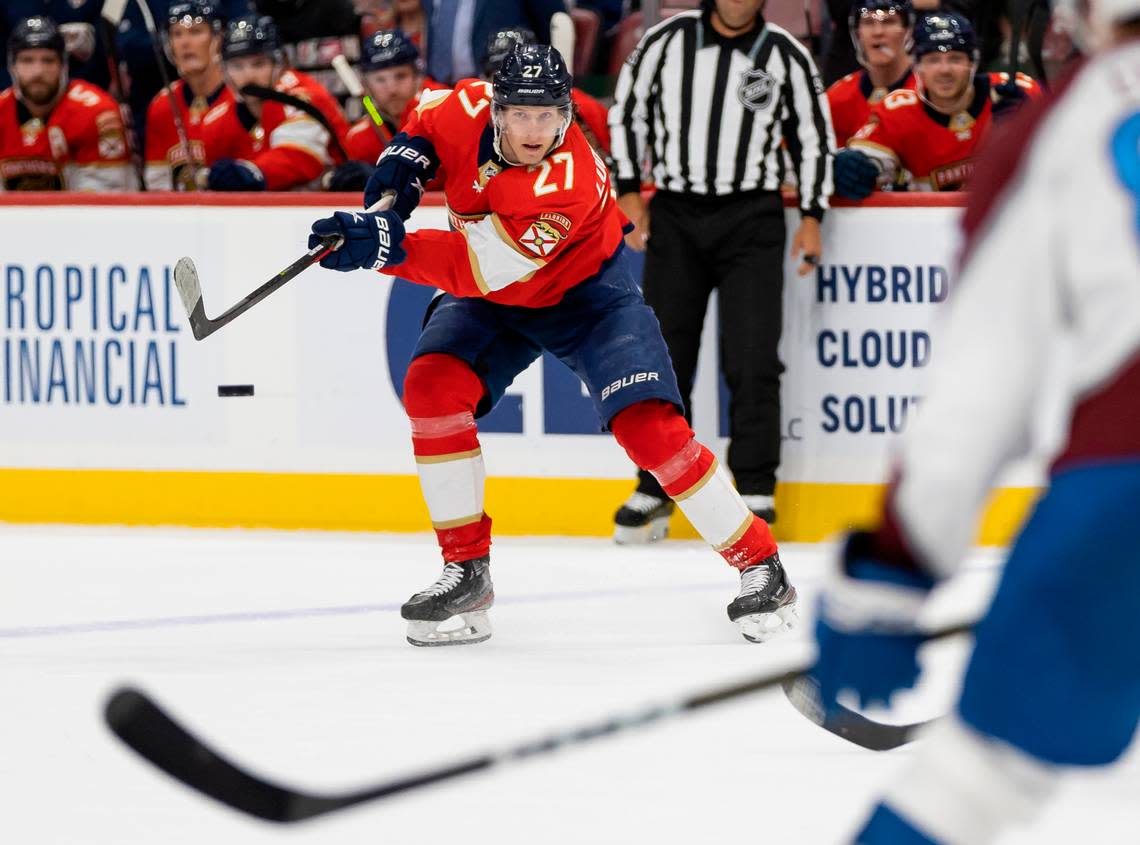 Florida Panthers center Eetu Luostarinen (27) passes the puck while Colorado Avalanche defenseman Andreas Englund (88) watches during the second period of an NHL game at the FLA Live Arena on Saturday, Feb. 11, 2023, in Sunrise, Fla.