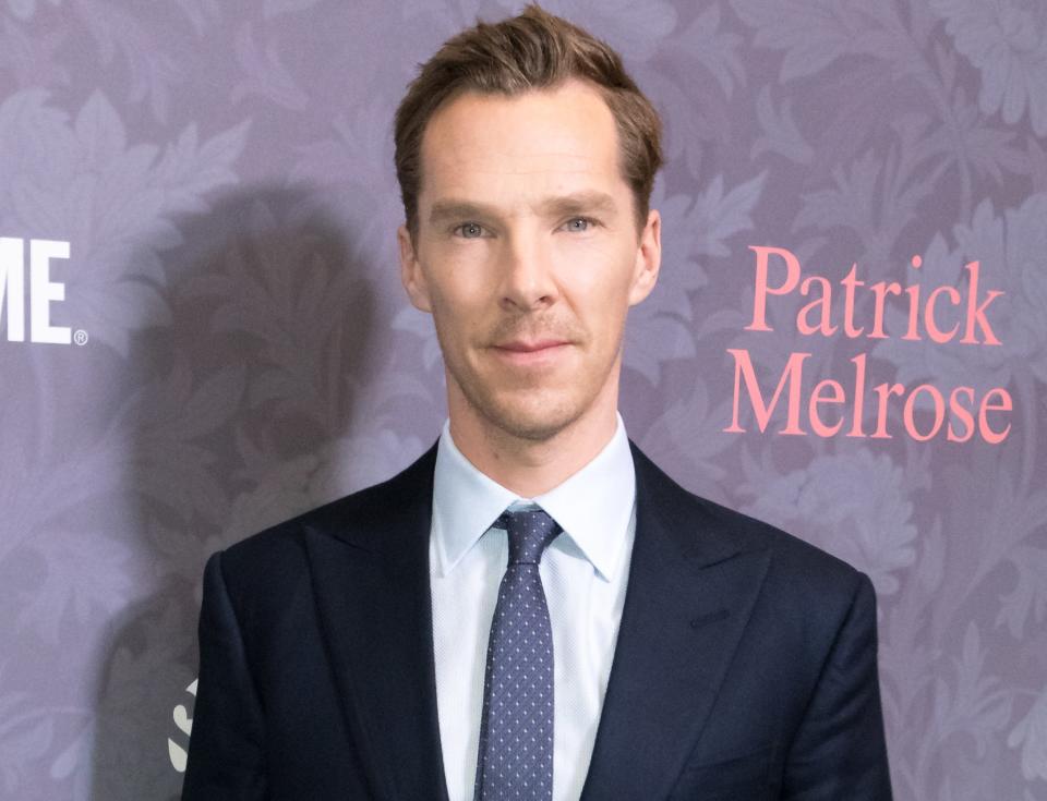 Benedict wears a suit with a navy tie to an event