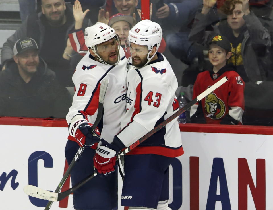 Washington Capitals left wing Alex Ovechkin (8) celebrates his goal against the Ottawa Senators with right wing Tom Wilson (43) during the second period of an NHL hockey game Friday, Jan. 31, 2020, in Ottawa, Ontario. (Fred Chartrand/The Canadian Press via AP)