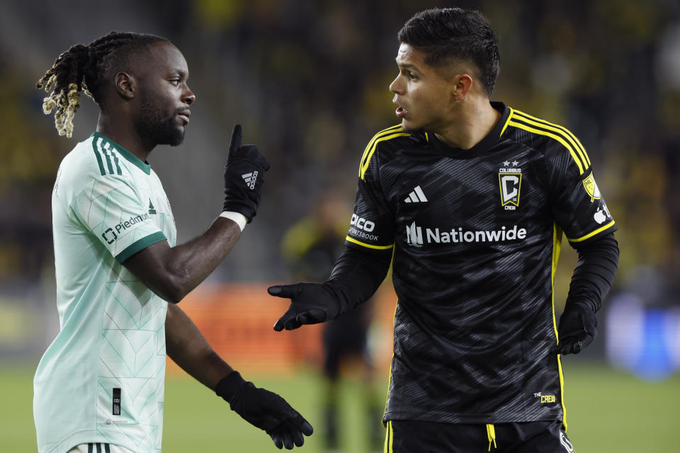 Atlanta United's Tristan Muyumba, left, and Columbus Crew's Cucho Hernandez argue during the second half of an MLS playoff soccer match Sunday, Nov. 12, 2023, in Columbus, Ohio. (AP Photo/Jay LaPrete)