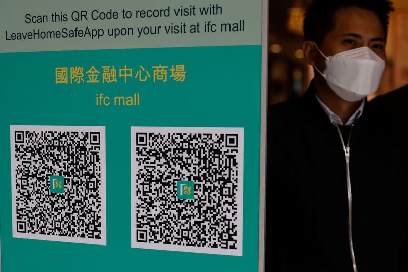 QR codes for the "LeaveHomeSafe" COVID-19 contact-tracing app are seen inside a shopping mall in Hong Kong