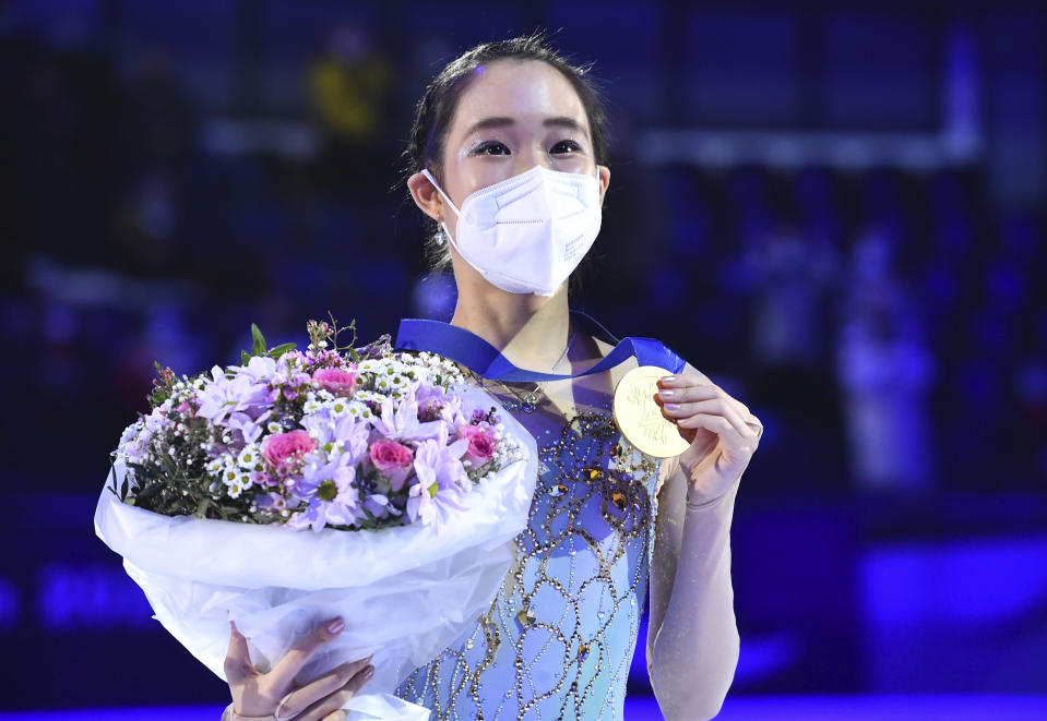 A winner Mai Mihara of Japan pose with her gold medal after the women free skating program during the ISU Four Continents Figure Skating Championships in Tallinn, Estonia, Saturday, Jan. 22, 2022. (AP Photo/Sergei Stepanov)