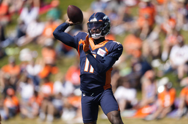 Denver Broncos quarterback Josh Johnson hits wide receiver Brandon