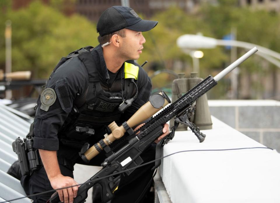 A US Secret Service counter-sniper (CS) team member provides overwatch for the presidential motorcade with a bolt-action rifle related to the US Marine Corps Mk 13 Mod 7 in 2018. <em>USSS</em>