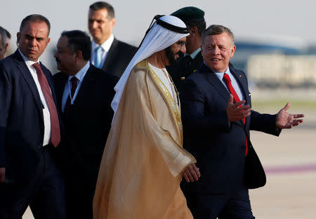 Jordan's King Abdullah II welcomes Prime Minister and Vice-President of the United Arab Emirates and ruler of Dubai Sheikh Mohammed bin Rashid al-Maktoum during a reception ceremony at the Queen Alia International Airport in Amman, Jordan March 28, 2017. REUTERS/Muhammad Hamed