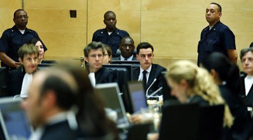 Congolese warlord Thomas Lubanga (C) hears the first-ever sentence delivered by The International Criminal Court (ICC) in the Hague. The International Criminal Court jailed Lubanga for 14 years Tuesday for using child soldiers in his rebel army, the first sentence to be handed down by the world's only permanent war crimes tribunal