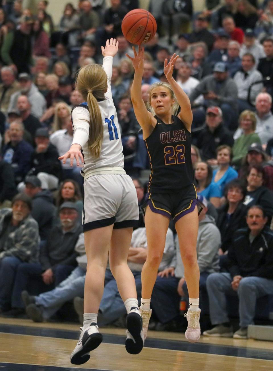 OLSH's Claudia Ierullo (22) shoots a three point shot while being guarded by River Valley's Emilee Staats (11) during the second half of the PIAA 3A Semifinals game Monday night at Kiski Area High School in Leechburg, PA.