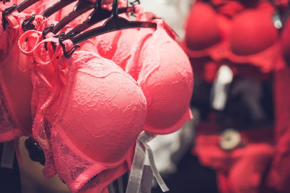 Red bras on a rack.