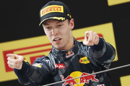 Formula One - Chinese F1 Grand Prix - Shanghai, China - 17/4/16 - Red Bull Formula One driver Daniil Kvyat of Russia celebrates after the Chinese Grand Prix. REUTERS/Aly Song