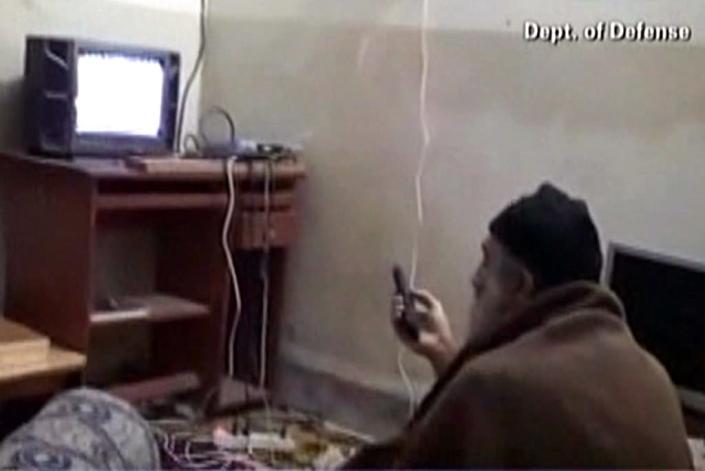 An undated video seized by US special forces in their 2011 raid on Osama bin Laden's house in Abbottabad, Pakistan, reportedly shows the Al-Qaeda leader watching television (AFP Photo/)