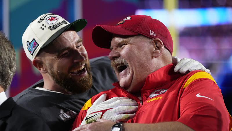 Kansas City Chiefs head coach Andy Reid, right, and Travis Kelce (87) celebrate their win after Super Bowl 57 on Feb. 12, 2023, in Glendale, Ariz.