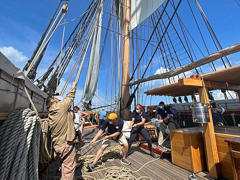 Crew members pull lines on the U.S. Brig Niagara, on Aug. 25, 2022, during the Parade of Sail on Presque Isle Bay. The Pennsylvania Historical & Museum Commission, which is taking over control of operations, plans to continue participating in Tall Ships events.