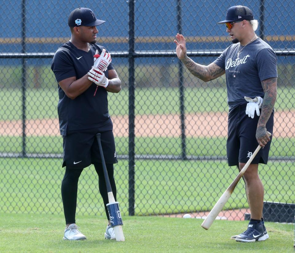 Tigers Infielders Andy Ibanez, left, and Javier Baez talk before taking batting practice during spring training on Thursday, Feb.  16, 2023, in Lakeland, Florida.