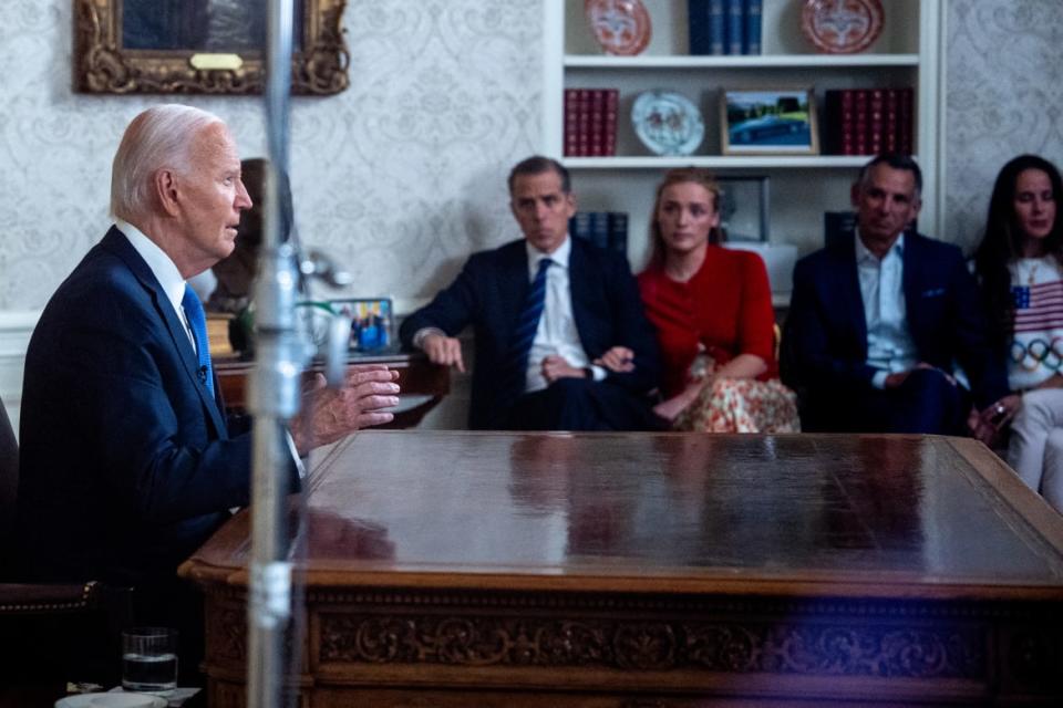 (L-R) U.S. President Joe Biden, accompanied by his son, Hunter Biden, Hunter's daughter Finnegan Biden, Howard Krein, and Ashley Biden,
