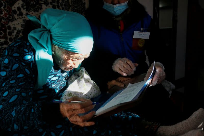 People take part in the election of Kyrgyz president and a referendum on the form of government in Koy-Tash