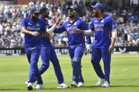 India players leave the field after dismissing England during the third one day international cricket match between England and India at Emirates Old Trafford cricket ground in Manchester, England, Sunday, July 17, 2022. (AP Photo/Rui Vieira)