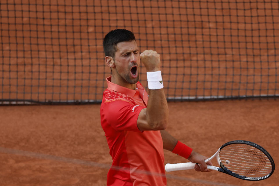 Serbia's Novak Djokovic celebrates winning his quarterfinal match of the French Open tennis tournament against Russia's Karen Khachanov in four sets, 4-6, 7-6 (7-0), 6-2, 6-4, at the Roland Garros stadium in Paris, Tuesday, June 6, 2023. (AP Photo/Jean-Francois Badias)