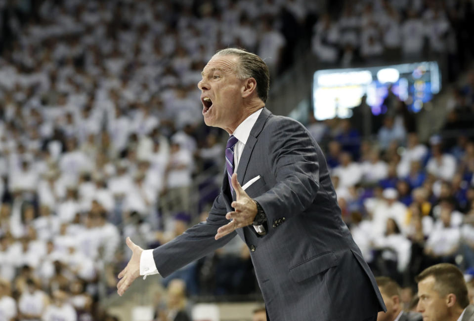 TCU head coach Jamie Dixon instructs his team in the first half of an NCAA college basketball game against Kansas in Fort Worth, Texas, Monday, Feb. 11, 2019. (AP Photo/Tony Gutierrez)