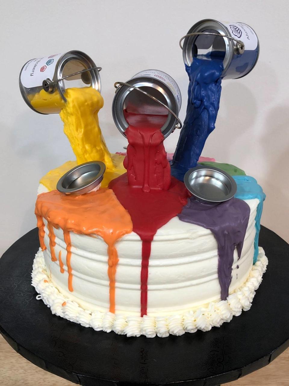 Jay Dawson, baker and co-owner of Always Original Bakery that will open in West Columbia, baked a cake with floating paint cans for an event.