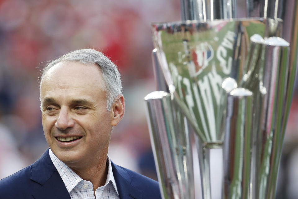 Major League Baseball Commissioner Rob Manfred stands with trophy before the MLB Home Run Derby, at Nationals Park, Monday, July 16, 2018 in Washington. The 89th MLB baseball All-Star Game will be played Tuesday. (AP)