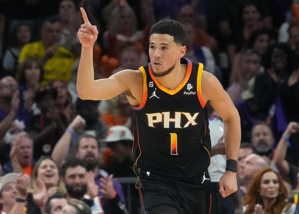 Phoenix Suns guard Devin Booker (1) reacts to making a shot against the Denver Nuggets during Game 3 of the Western Conference Semifinals at the Footprint Center in Phoenix on May 5, 2023.